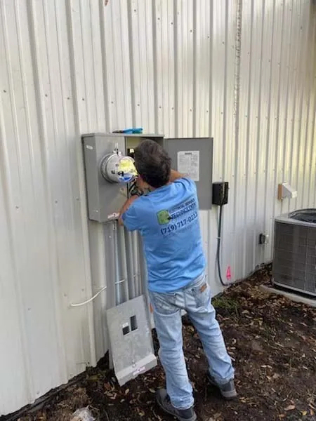 John checking a new meter base and service panel