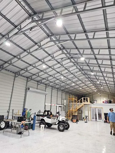 Large steel building with rows of high-bay lights